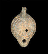 Oil lamp decorated with a cross