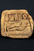 Tablet depicting a reclining female and three children