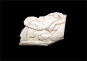 Ivory plaque depicting a reclining female