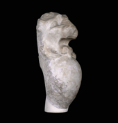 Head of a lion surmounting an oval-shaped body bearing a dedication 