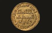 دينار أموي من الذهب ضُرب في سنة 106 هجريًّا (724 م) 